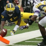 M FOOTBALL 2012-WILDCATS NO LONGER MILDCATS-WOLVERINES PREVAIL IN OVERTIME WITH 38 TO NORTHWESTERN’S 31.